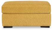 Ashley Furniture Keerwick living room set with sofa and armchair, featuring neutral fabric upholstery and modern design.