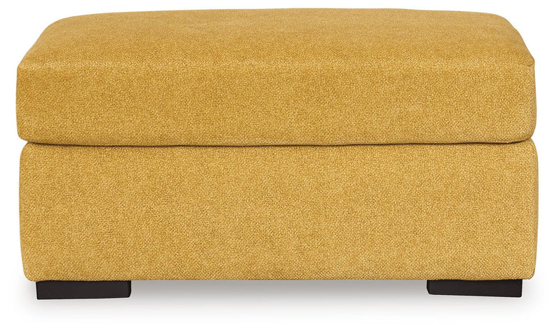 Ashley Furniture Keerwick living room set with sofa and armchair, featuring neutral fabric upholstery and modern design.