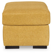 Ashley Furniture Keerwick living room set with sofa and armchair in a cozy, modern design, shown from a side angle.