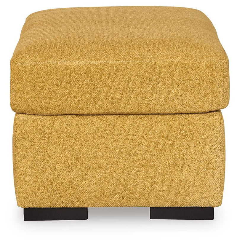 Ashley Furniture Keerwick living room set with sofa and armchair in a cozy, modern design, shown from a side angle.
