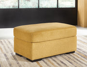 Ashley Furniture Keerwick living room set featuring a sofa and armchair in a modern design with neutral upholstery.