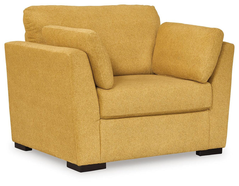 Ashley Furniture Keerwick living room set with sofa and loveseat in a modern design, shown from an angled perspective.