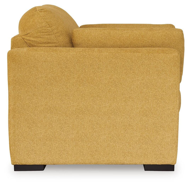 Ashley Furniture Keerwick living room set with sofa and armchair, featuring neutral upholstery and modern design.