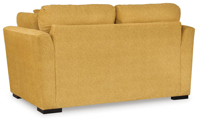 Ashley Furniture Keerwick living room set with sofa and armchair, featuring plush cushions and stylish upholstery.