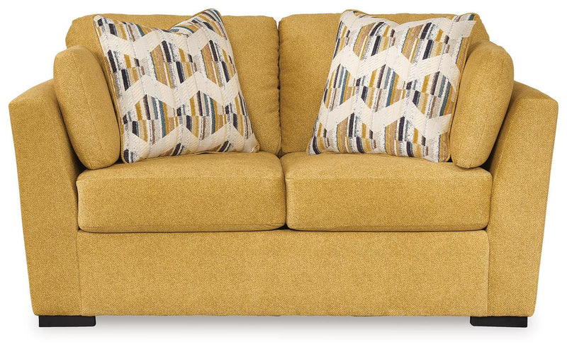 Ashley Furniture Keerwick living room set with sofa and loveseat, featuring plush cushions and modern design.