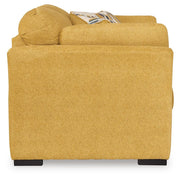 Ashley Furniture Keerwick living room set with sofa and armchair, featuring plush cushions and neutral upholstery.