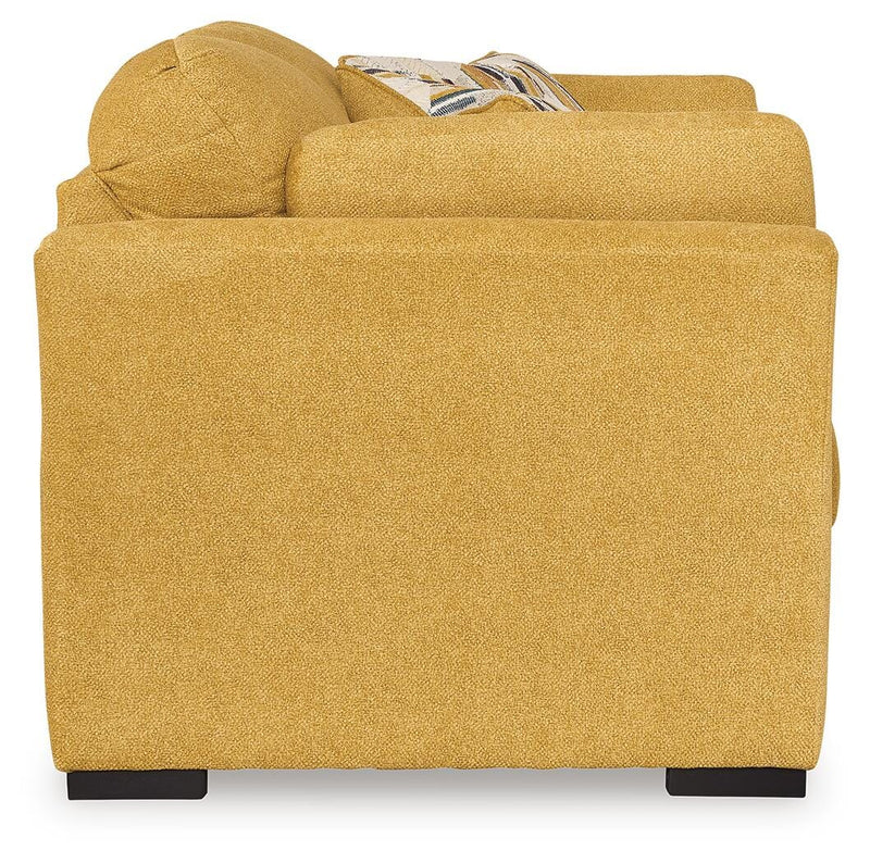 Ashley Furniture Keerwick living room set with sofa and armchair, featuring plush cushions and neutral upholstery.