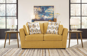 Ashley Furniture Keerwick living room set with plush sofa and matching armchair in a modern design, shown in a cozy living space.