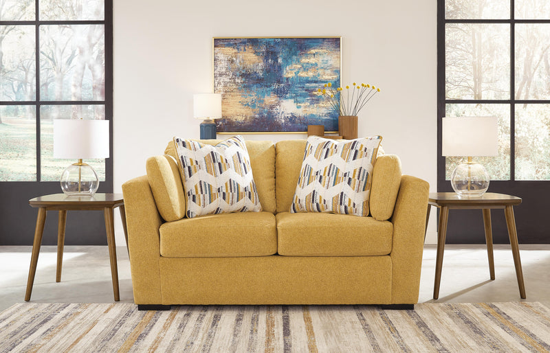 Ashley Furniture Keerwick living room set with plush sofa and matching armchair in a modern design, shown in a cozy living space.