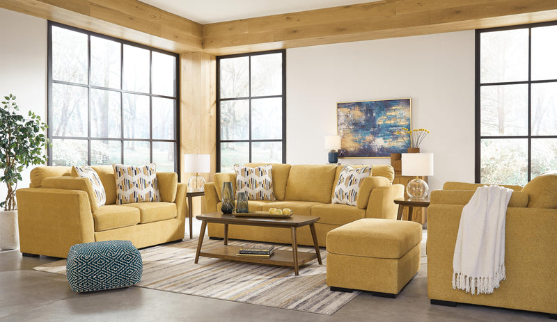 Ashley Furniture Keerwick living room set featuring a sofa, loveseat, and armchair with neutral upholstery and modern design.