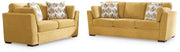 Ashley Furniture Keerwick living room set with fabric sofa and loveseat, modern design in neutral tones.