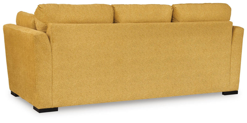 Ashley Furniture Keerwick sofa sleeper with dark fabric upholstery and cushioned armrests, shown from the back view.