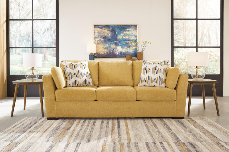 Ashley Furniture Keerwick living room set featuring a sofa, loveseat, and coffee table in a stylish modern design.