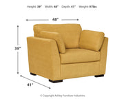 Ashley Furniture Keerwick living room set with sofa and armchair in a modern design, featuring neutral upholstery and plush cushions.