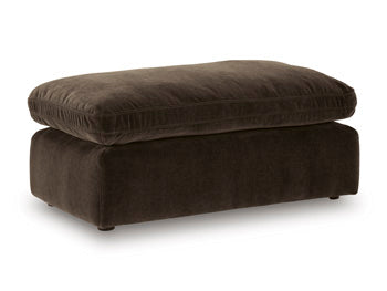 Ashley Furniture Maxton Heights Ottoman, stylish fabric ottoman with wooden legs, shown from an angled view.