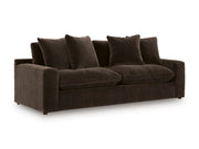 Ashley Furniture Maxton Heights Sofa shown from an angle, featuring plush cushions and modern design in neutral fabric.