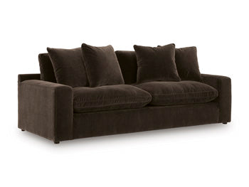 Ashley Furniture Maxton Heights Sofa shown from an angle, featuring plush cushions and modern design in neutral fabric.