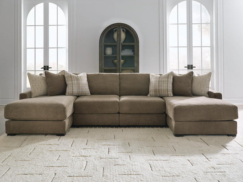 Ashley Furniture Camellia-Court double chaise sectional with plush cushions and modern design, shown in a stylish living room setting.