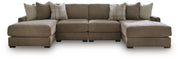 Ashley Furniture Camellia-Court double chaise sectional with plush fabric and modern design, shown with the sectional in a living room setting.