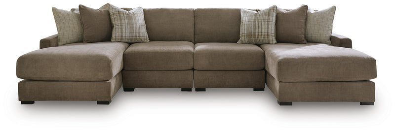 Ashley Furniture Camellia-Court double chaise sectional with plush fabric and modern design, shown with the sectional in a living room setting.