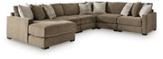 Ashley Furniture Camellia-Court sectional with chaise showing plush fabric upholstery and modern design in a living room setting.