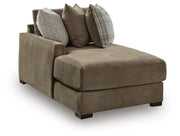 Ashley Furniture Camellia-Court sectional with chaise, modern upholstered sofa showing a sectional with a chaise lounge in a stylish living room.