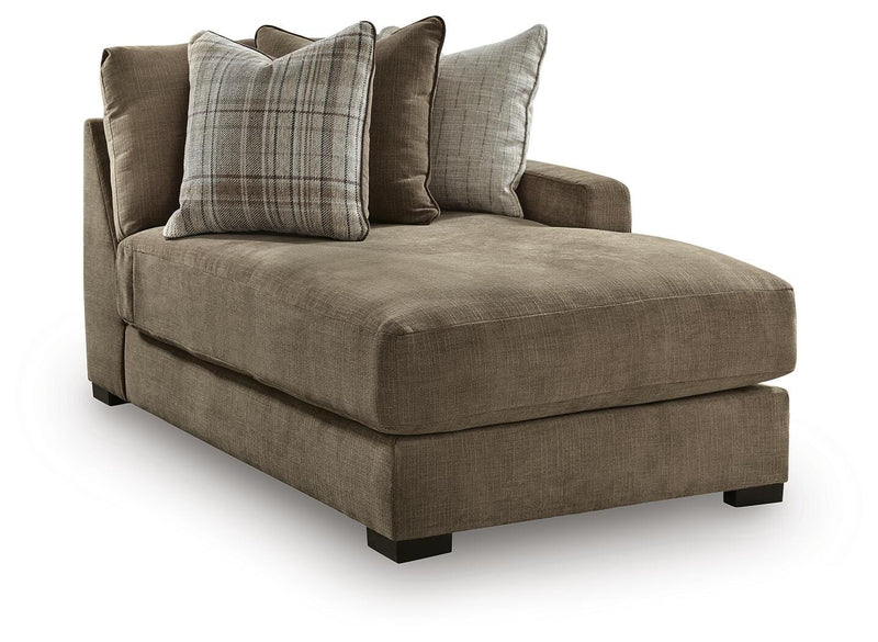 Ashley Furniture Camellia-Court sectional with chaise showing a modern, plush fabric sofa in a stylish living room setting.