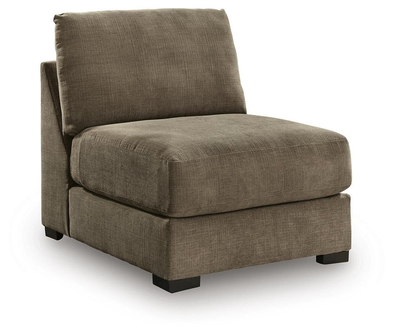 Angle view of Ashley Furniture Camellia-Court sectional sofa with plush cushions and modern design in a living room setting.