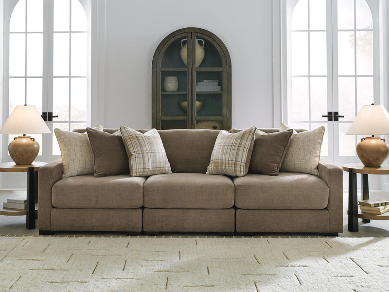 Ashley Furniture Camellia-Court sectional sofa showing plush cushions and modern design in a stylish living room setting.