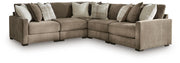 Ashley Furniture Camellia-Court sectional with plush fabric upholstery, featuring multiple seats and a modern design.