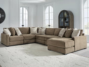 Ashley Furniture Camellia-Court sectional with chaise, modern fabric sofa showing plush cushions and extended chaise lounge.