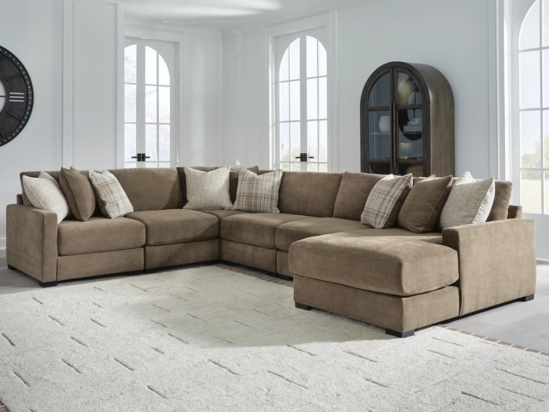 Ashley Furniture Camellia-Court sectional with chaise, modern fabric sofa showing plush cushions and extended chaise lounge.