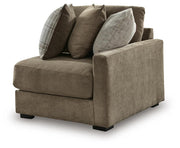 Ashley Furniture Camellia-Court sectional sofa in a modern living room, featuring plush cushions and neutral upholstery.