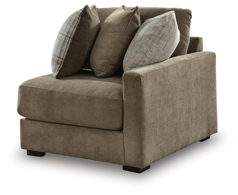 Ashley Furniture Camellia-Court sectional sofa in a modern living room scene, showcasing plush cushions and neutral fabric.