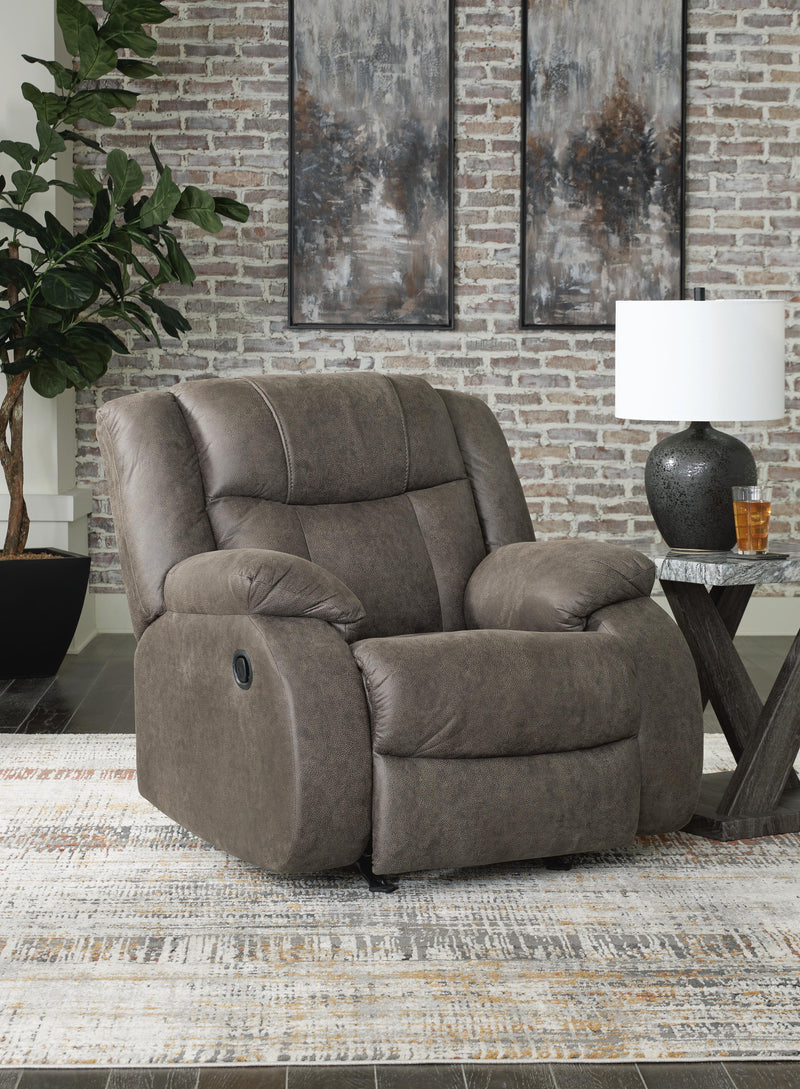 Ashley Furniture First Base Recliner in dark fabric, featuring a plush backrest and cushioned armrests for comfortable seating.