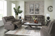 Ashley Furniture First Base living room set with sofa and loveseat in neutral fabric, arranged in a modern living room setting.
