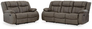 Ashley Furniture First Base living room set featuring a plush sofa and matching armchair in a modern design.