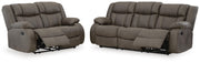 Open Ashley Furniture First Base living room set with sofa and loveseat, featuring neutral upholstery and modern design.