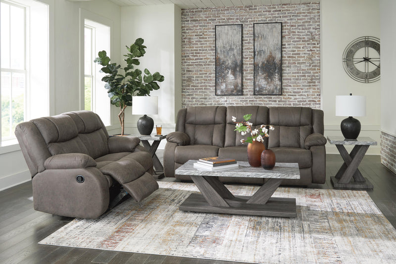 Ashley Furniture First Base living room set featuring a plush sofa and matching armchair in a contemporary design.