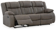 Ashley Furniture First Base reclining sofa shown from an angled open view, featuring plush cushions and a modern design.