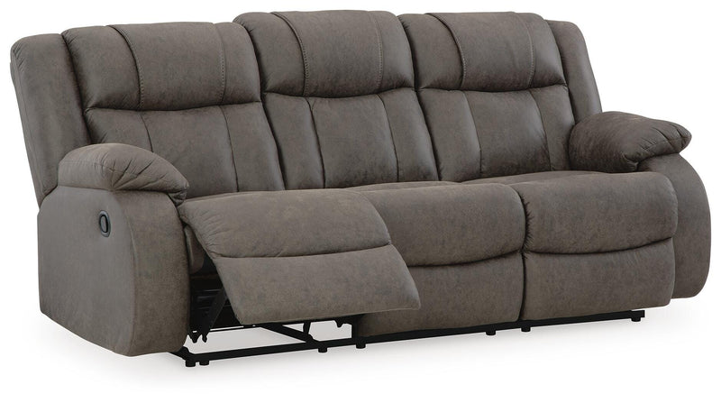 Ashley Furniture First Base reclining sofa shown from an angled open view, featuring plush cushions and a modern design.