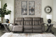 Open view of Ashley Furniture First Base Reclining Sofa showing plush fabric and adjustable reclining sections.