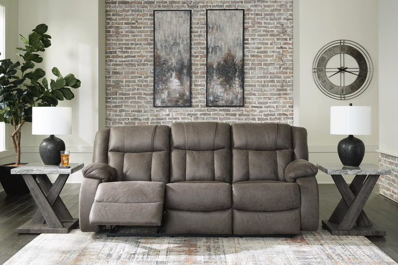 Open view of Ashley Furniture First Base Reclining Sofa showing plush fabric and adjustable reclining sections.