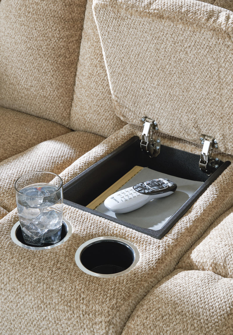 Close-up of the Ashley Furniture Tip-Off 2-Piece Living Room Set console with dark wood finish and modern design details.