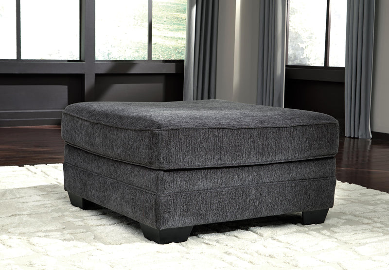 Ashley Furniture Tracling living room set with sofa and loveseat featuring neutral upholstery and modern design.