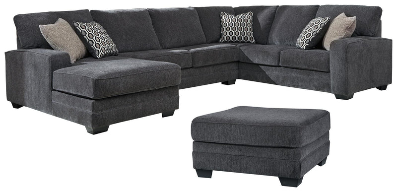 Ashley Furniture Tracling living room set with sofa, loveseat, and armchair in a modern design, featuring neutral upholstery.