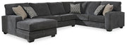 Ashley Furniture Tracling living room set with sofa and armchair in a modern design, featuring neutral upholstery and stylish cushions.