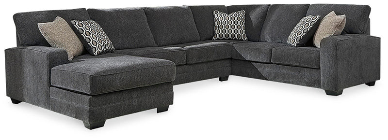 Ashley Furniture Tracling living room set with sofa and armchair in a modern design, featuring neutral upholstery and stylish cushions.