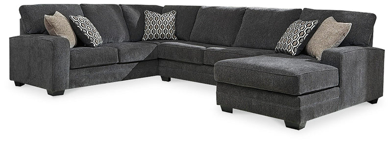 Ashley Furniture Tracling living room set featuring a sofa, loveseat, and armchair in a modern design with neutral upholstery.