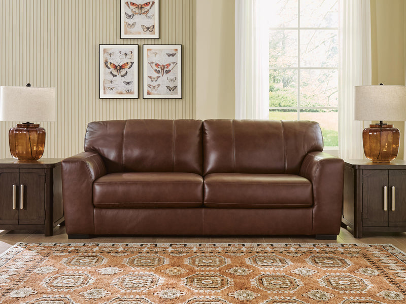 Ashley Furniture Brogliano living room set with sofa and armchair, featuring neutral upholstery and modern design.